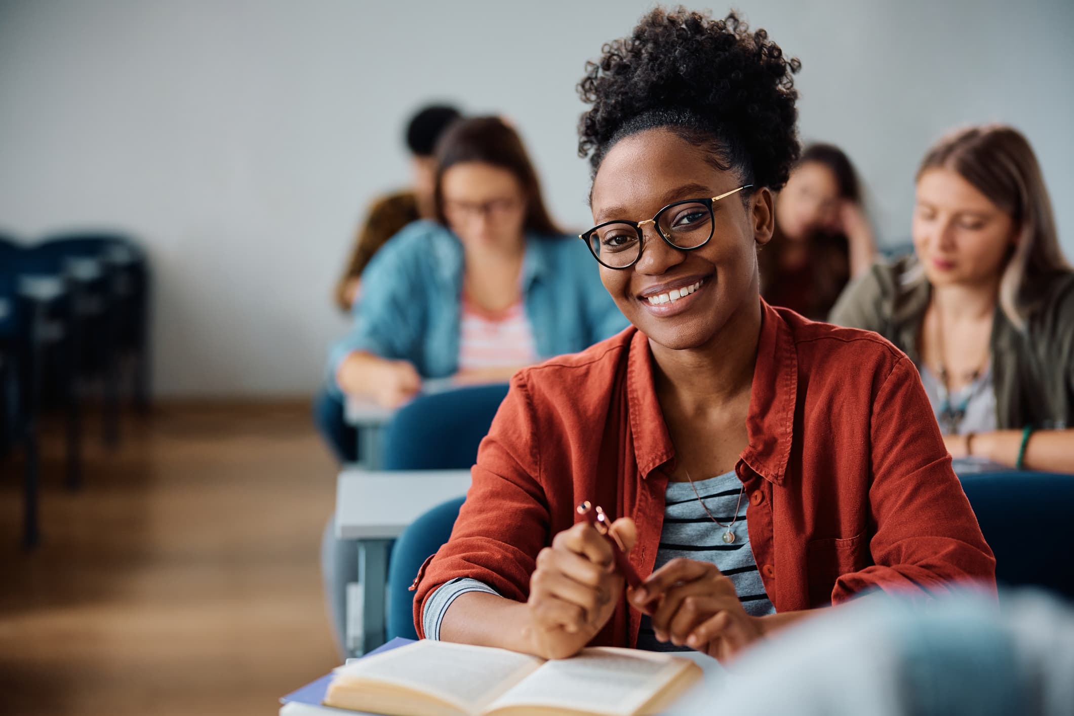 Happy African American woman attending a lecture